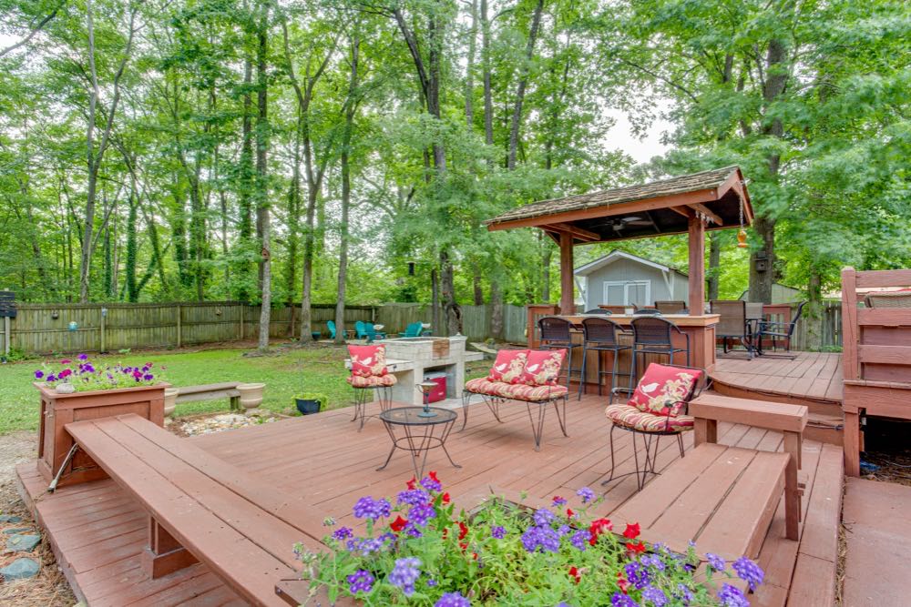 Finished backyard wood deck with outdoor furniture in Charlotte, NC